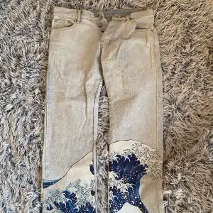 famous Japanese wave art patterned jeans with distressed bottoms.  In very great condition, only worn a few times.  The price can be discussed!:)