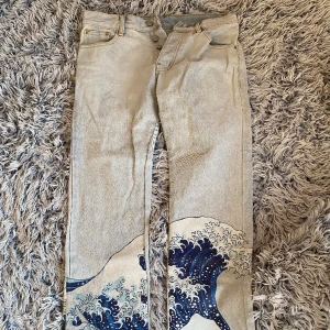 Japanese wave patterned jeans - famous Japanese wave art patterned jeans with distressed bottoms.  In very great condition, only worn a few times.  The price can be discussed!:)