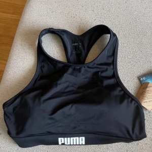 Puma sports bra  - A puma sports bra, never used and still has the tag on!