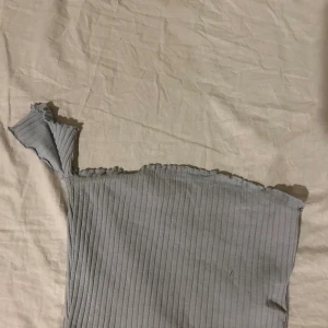 Topp - Enärmad topp 