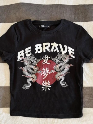 Black Ribbed Dragon Graphic Baby Tee - Black Ribbed Dragon Graphic Baby Tee  Excellent condition   Size XS   Shoulder to shoulder: 31cm Pit to pit: 34cm Length: 42cm