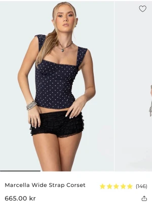 Prickig Korsett Topp - Såå snygg svart prickig korsett topp från Edikted. Sparaamt använd och i princip i nyskick!🤍🤍