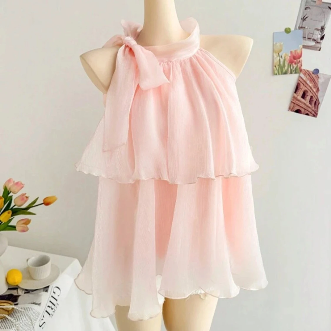 Ljusrosa ärmlös blus med rosett