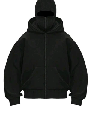 Svart hoodie med dragkedja och huva - Säljer en svart hoodie med hel dragkedja och stor huva och inbyggd ski mask som täcker ansiktet. Hoodien har en oversized passform, ribbade muddar. Perfekt för en streetwear-look och riktigt skön att bära.