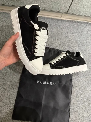 Numeris black and white shoes 45 - Size 45, true to size. Very comfortable and soft. Brand new, never worn outside. 