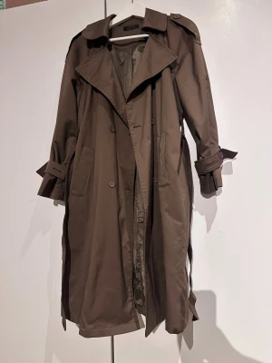 Trench coat  - Really good condition used twice only brandnew price is 550. color is khaki 