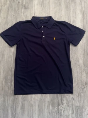 Mörkblå polo pike - Storlek s 