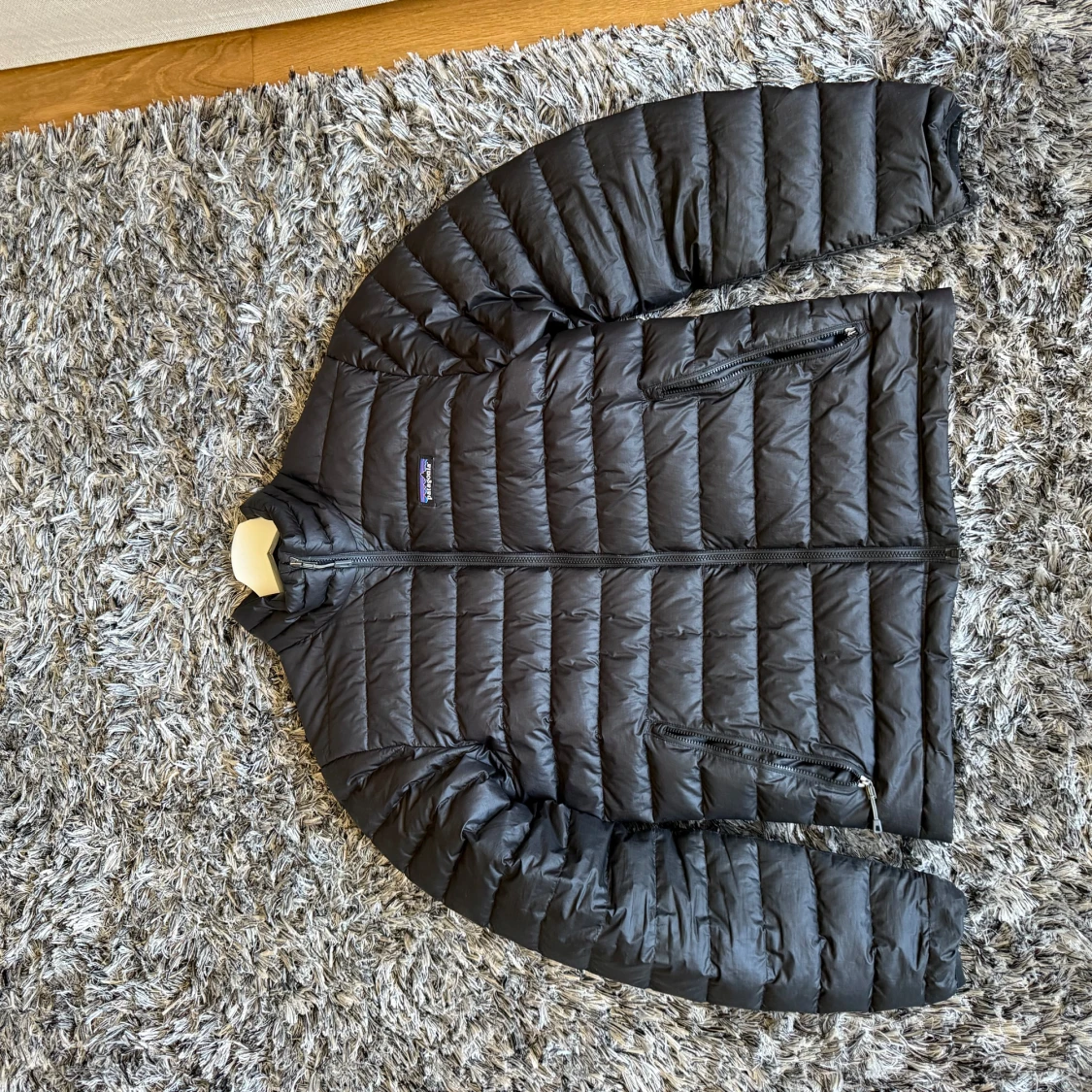 Svart dunjacka från Patagonia