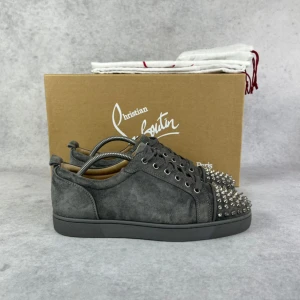 Christian Louboutin junior spike sneaker - – Condition: 8,5/10  – Color: Grey  - What is included: Box & dustbag  – Retail price: 9000 + SEK