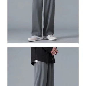 Grå wide mjukisbyxor med snörning - Snygga grå byxor med bred passform och elastisk midja med snörning. Byxorna har raka, vida ben och är tillverkade i ett mjukt material som känns skönt mot huden.