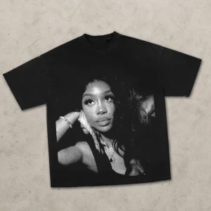 Black Graphic Tee with SZA  - Standout black t-shirt featuring a bold, halftone-style portrait of SZA. 