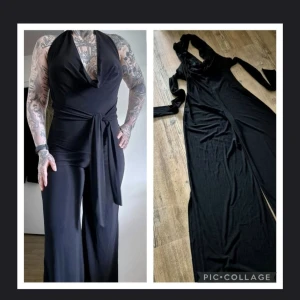 Svart byxdress med omlott och knyt - Säljer en svart byxdress med omlott-ringning och breda ben. Byxdressen har knyt i midjan och är tillverkad i ett mjukt, stretchigt material som sitter snyggt. Perfekt för dig som gillar en stilren look med lite edge.