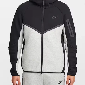 Nike Tech Fleece hoodie svart/grå - Nike Tech Fleece hoodie i svart och ljusgrått med dragkedja och huva. Storlek SX men passar S och M