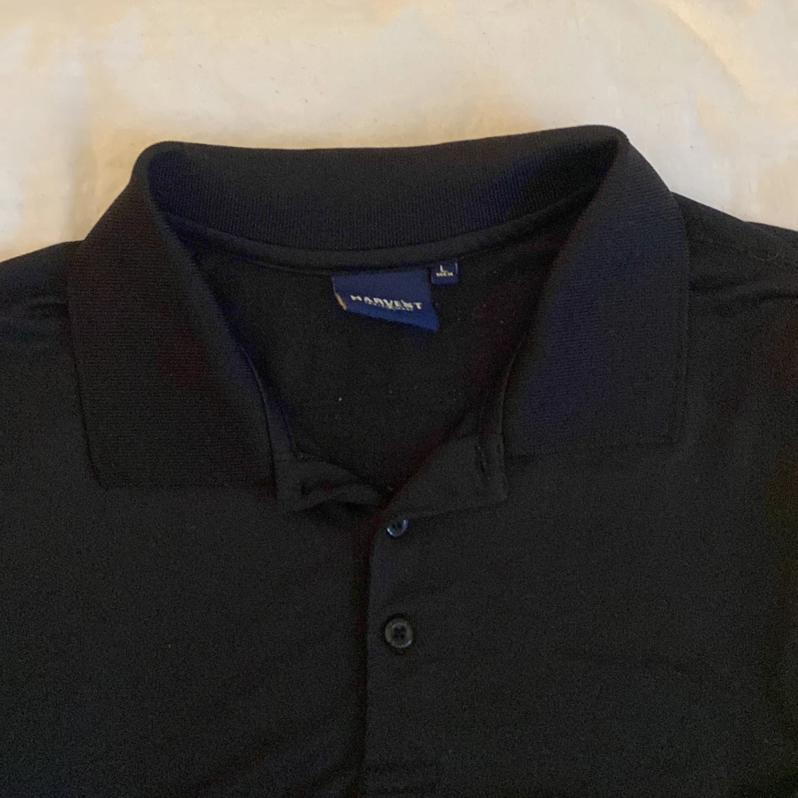 Svart pikétröja från James Harvest - 2