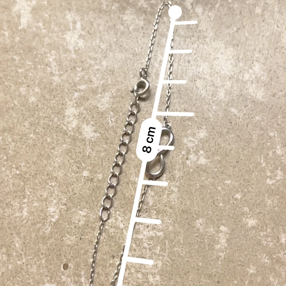 Silverfärgat armband med oändlighetssymbol - 1