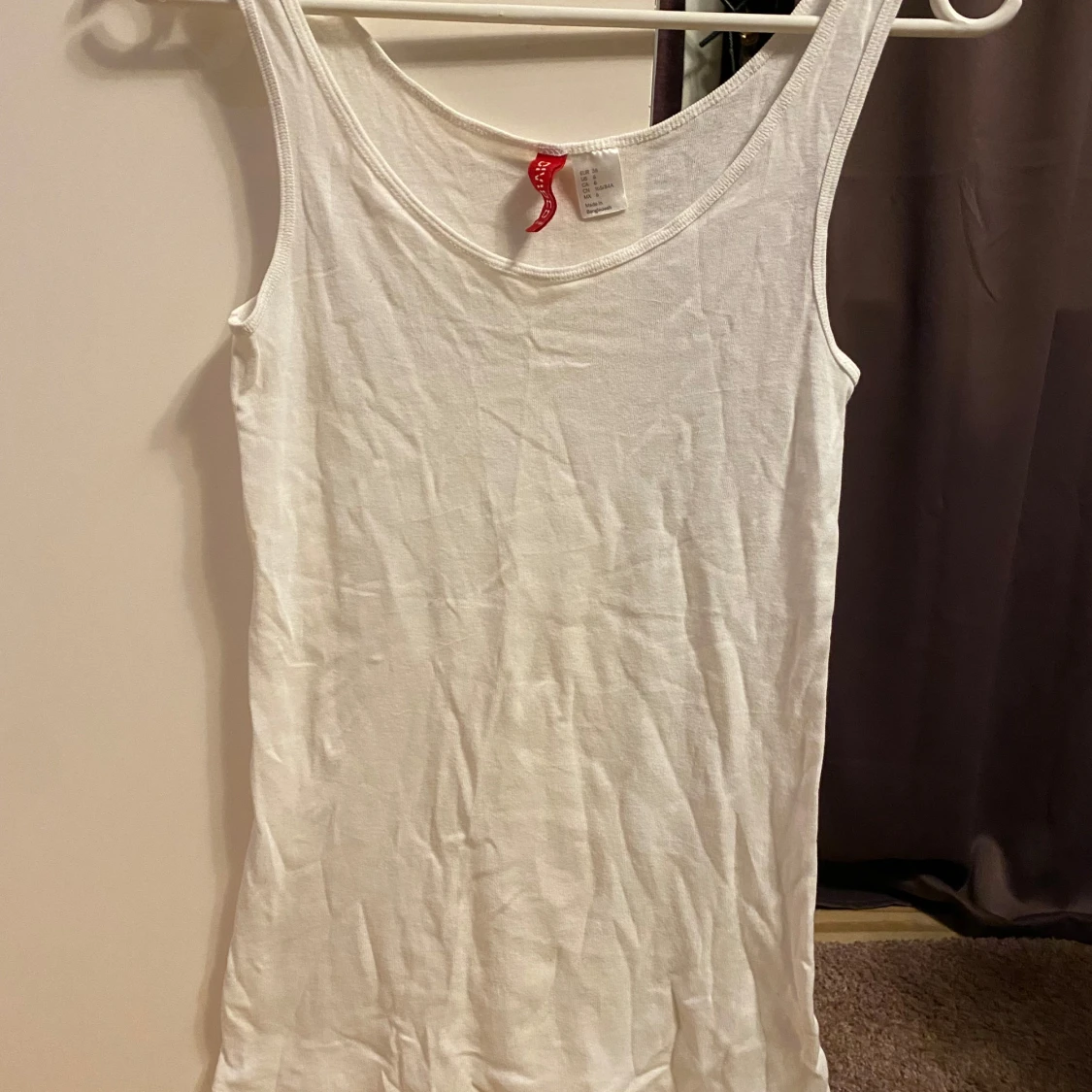 Vit linnetopp från Divided