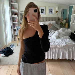 Topp - Topp med en arm 