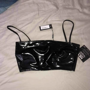  - Latex top från Nelly i storlek xxs. Oanvänd.