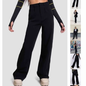  - Aldrig använda kostymbyxor. Svarta. Justeringsbar midja. Frakt ingår inte i priset.