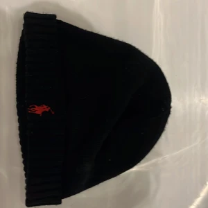 Ralph Lauren Mössa - Stickad Ralph lauren  mössa . Pris diskuteras