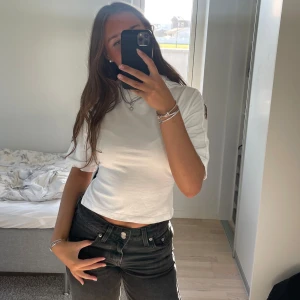 Nelly topp - Säljer denna populära T-shirten från Nelly, aldrig använd i storlek XS