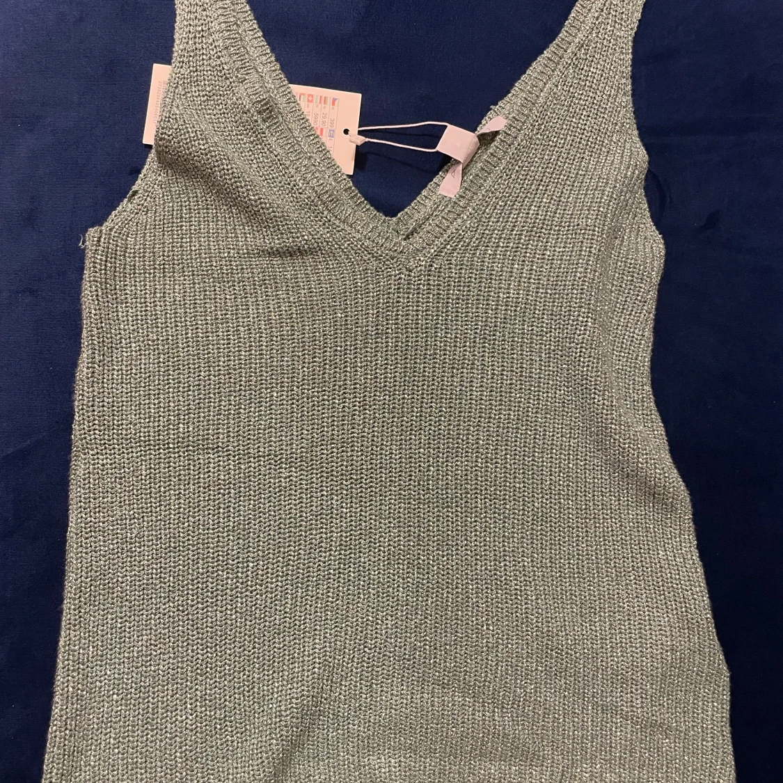 Grön stickad linnetopp från Amisu