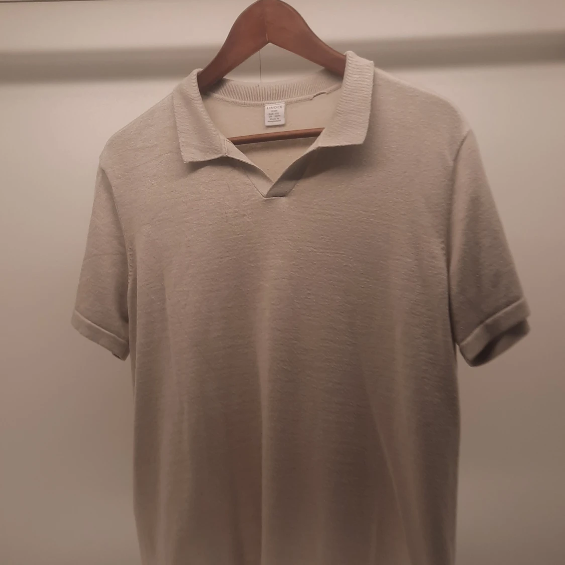 Beige pikétröja från Lindex