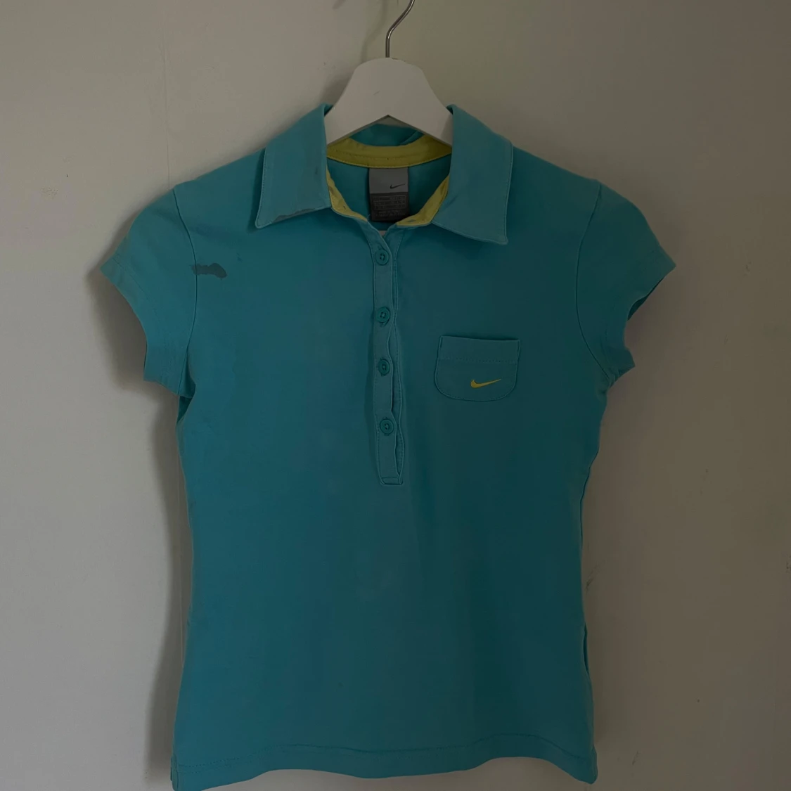 Turkos pikétröja från Nike - 91