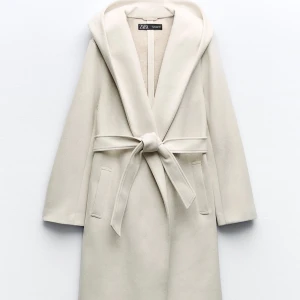 Kappa med huva - Kappa använd enbart en gång. Storlek S.