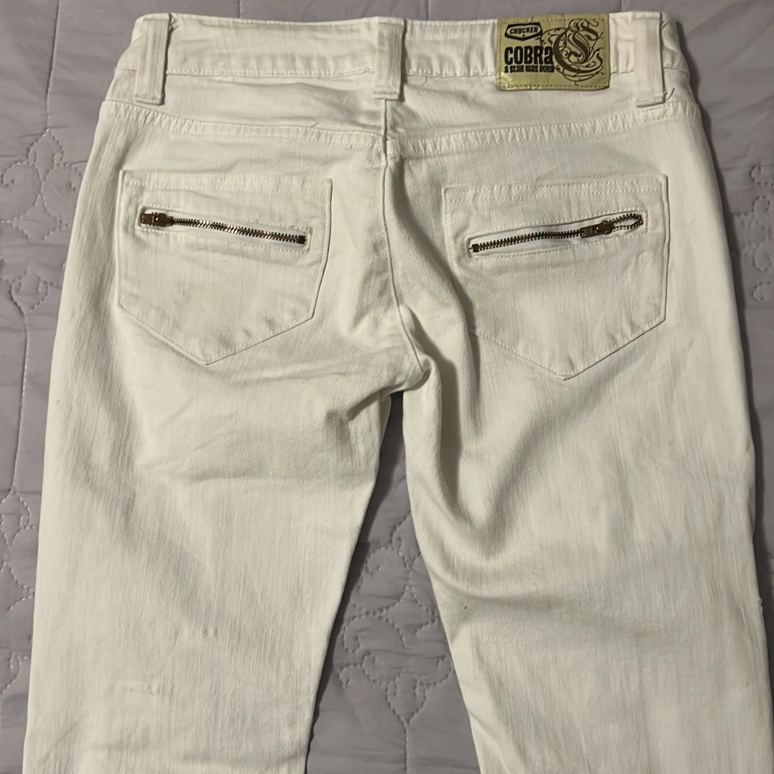 Vita jeans med slitningar och dragkedjor lågmidjade - 90