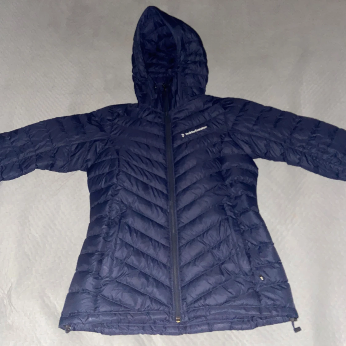 Blå dunjacka från Peak Performance