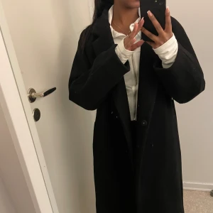 Kappa  - Svart kappa