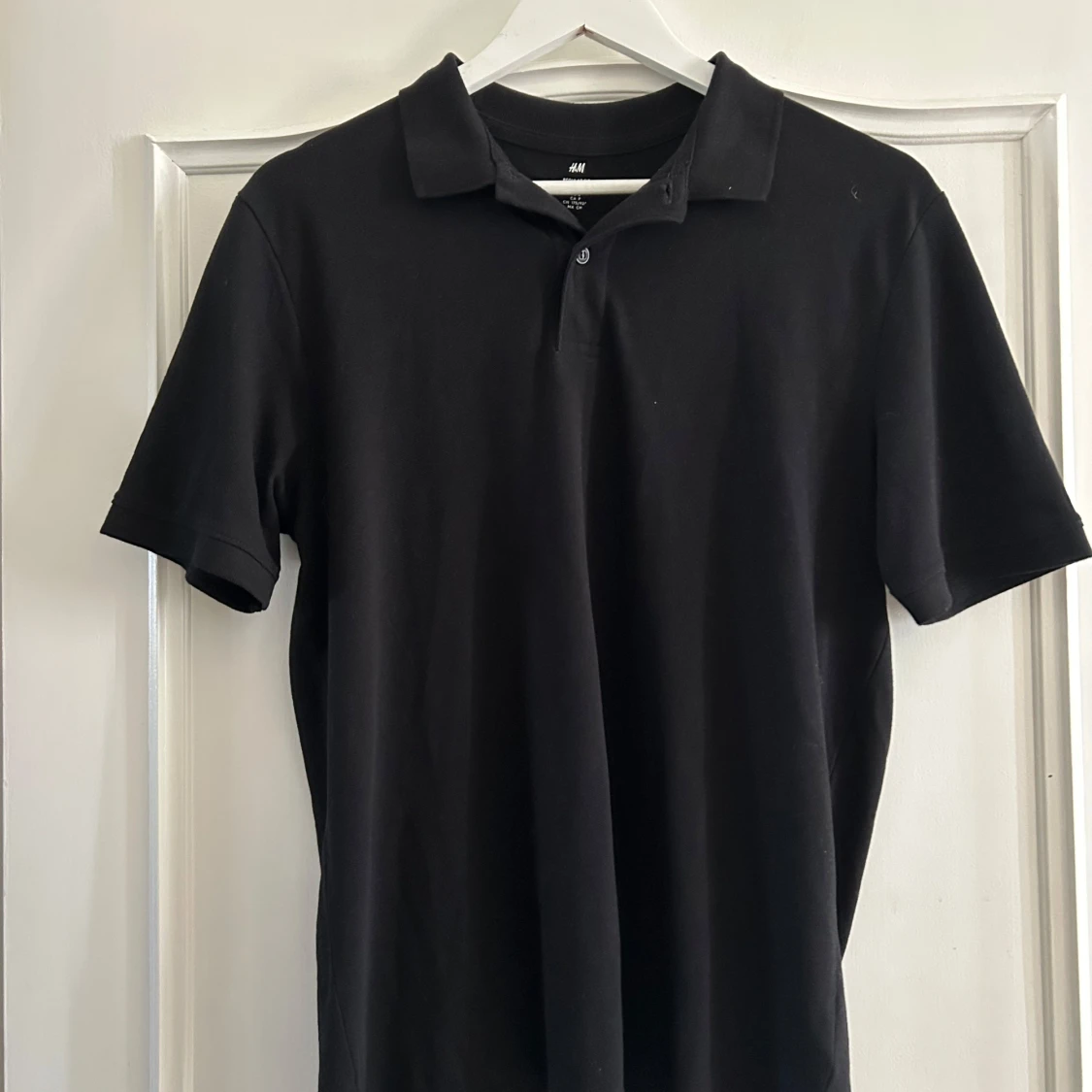 Svart pikétröja från H&M, storlek S