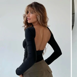 Svart långärmad topp med öppen rygg - Jättefin svart långärmad topp med öppen rygg från Venderbys i storlek XS/S. Som nyskick utan defekter! 🩷