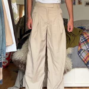 very wide beige pants from malene birger. fits nice in waist with long wide legs.