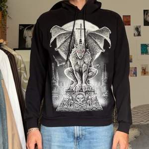 drained hoodie. silver gargoyle with red eyes and a cross. edgy delight.
