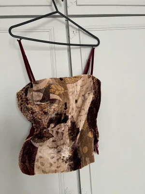 Corsette top with cute print  - Corsette top with cute print on. Size 42 and stretchy. 
