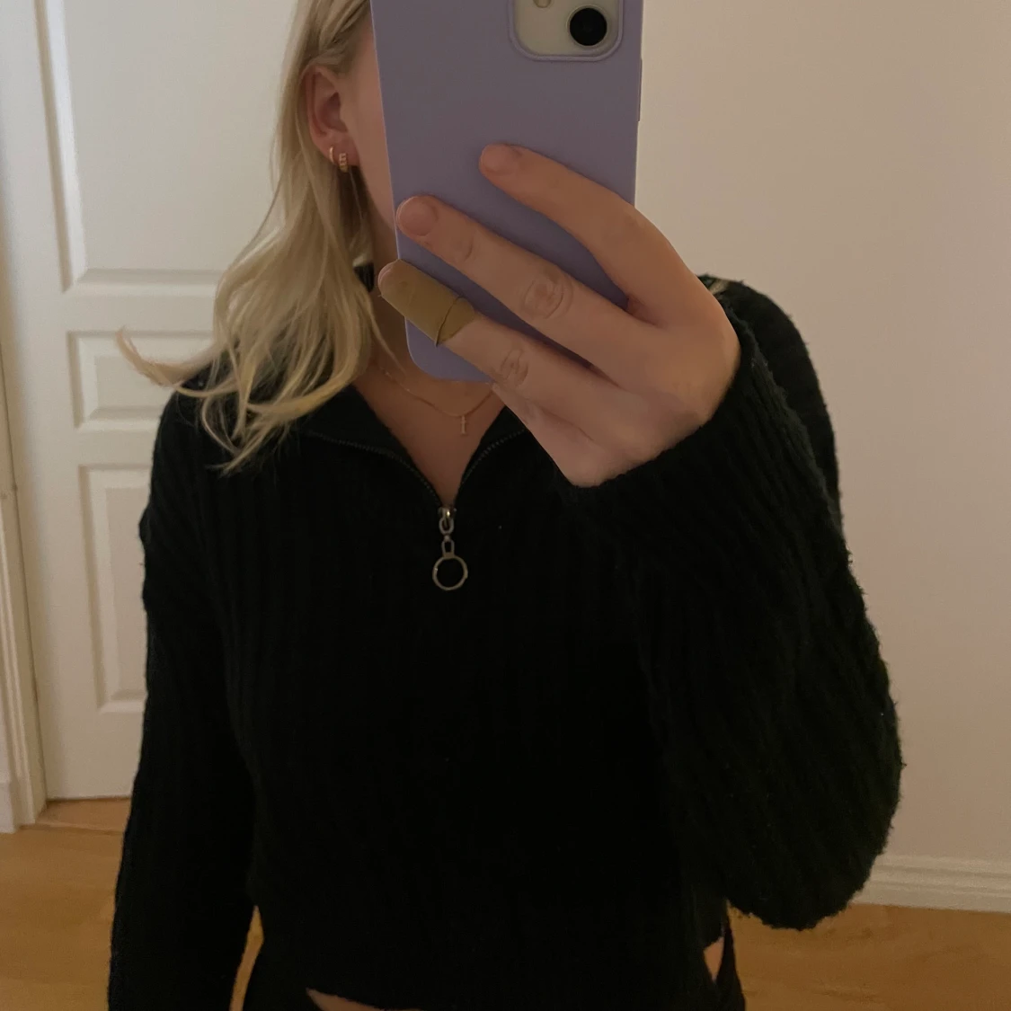 Stickad tröja med dragkedja