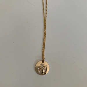 Halsband - Gulligt halsband med stjärntecken! (Tror de är skytten)