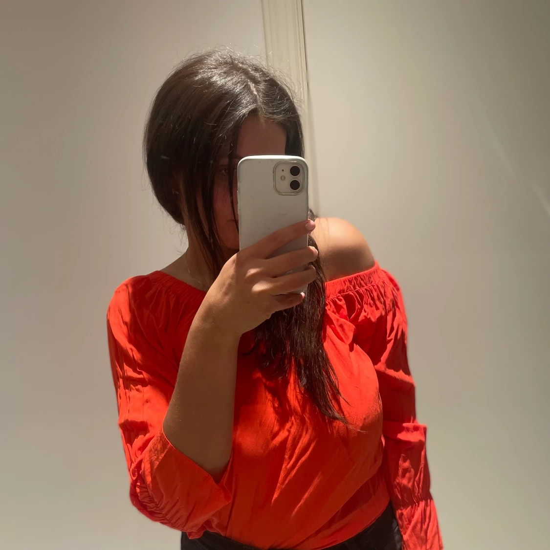 Oranga blus i storlek 34.