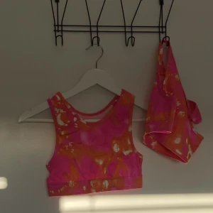 Sport bh - Rosa/orange sport bh från newbody. Aldrig använda.