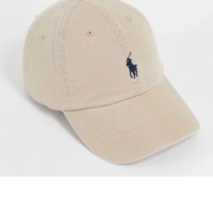 NY RL keps - Oanvänd one size. Inplastad. Nypris 600kr