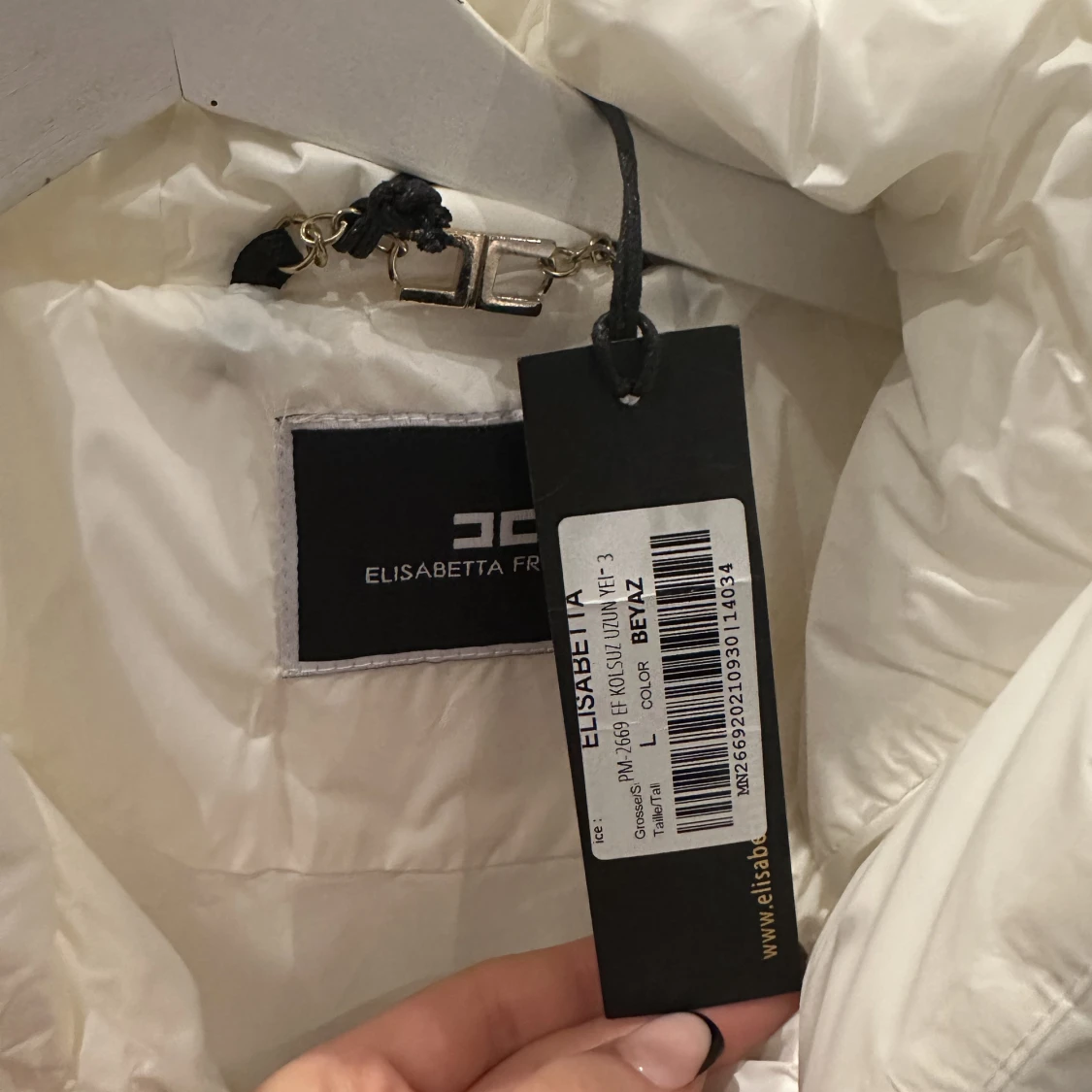 Lång vit väst  - 91