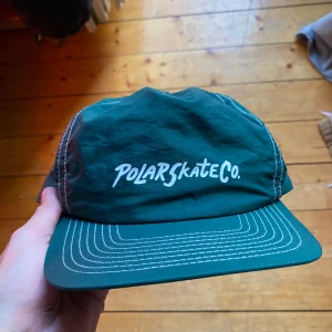 Polar Keps - Helt ny oanvänd Polar keps i grön 10/10