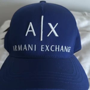 Armani Exchange Keps - Never used still have the tag