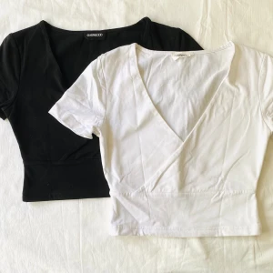 Två omlottoppar från Even&Odd - Supersöta små toppar, storlek XS. En svart och en vit. Priset avser båda