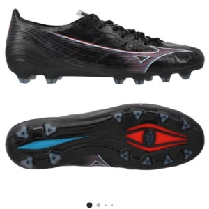 Mizuno Alpha Elite FG/AG Black Pack - Mizuno Alpha Elite FG/AG Black Pack. Svarta med skimmer. Helt nya, endast provade i ca 15 min. Säljer pga för stora. Kan fixa bilder på skorna.