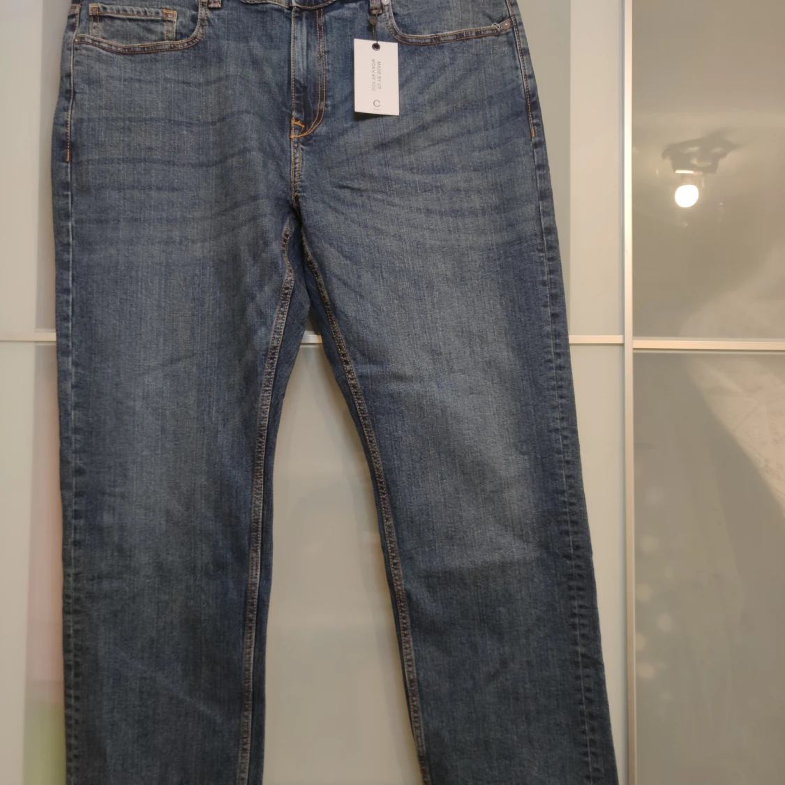 Oanvänd blå jeans, storlek 40/32