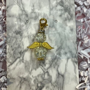 Genomskinlig och guld lyckoängel - Genomskinlig och guld lyckoängel.