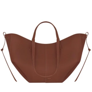 Poléne Cyme väska - Jag säljer nu min nya Poléne väska som jag köpt via Vinted. Aldrig använt då jag känner att det inte helt är min smak. Tillkommer med tillhörande dust bag och pouch. Färgen är mot det röd/bruna hållet. Skriv privat för fler bilder